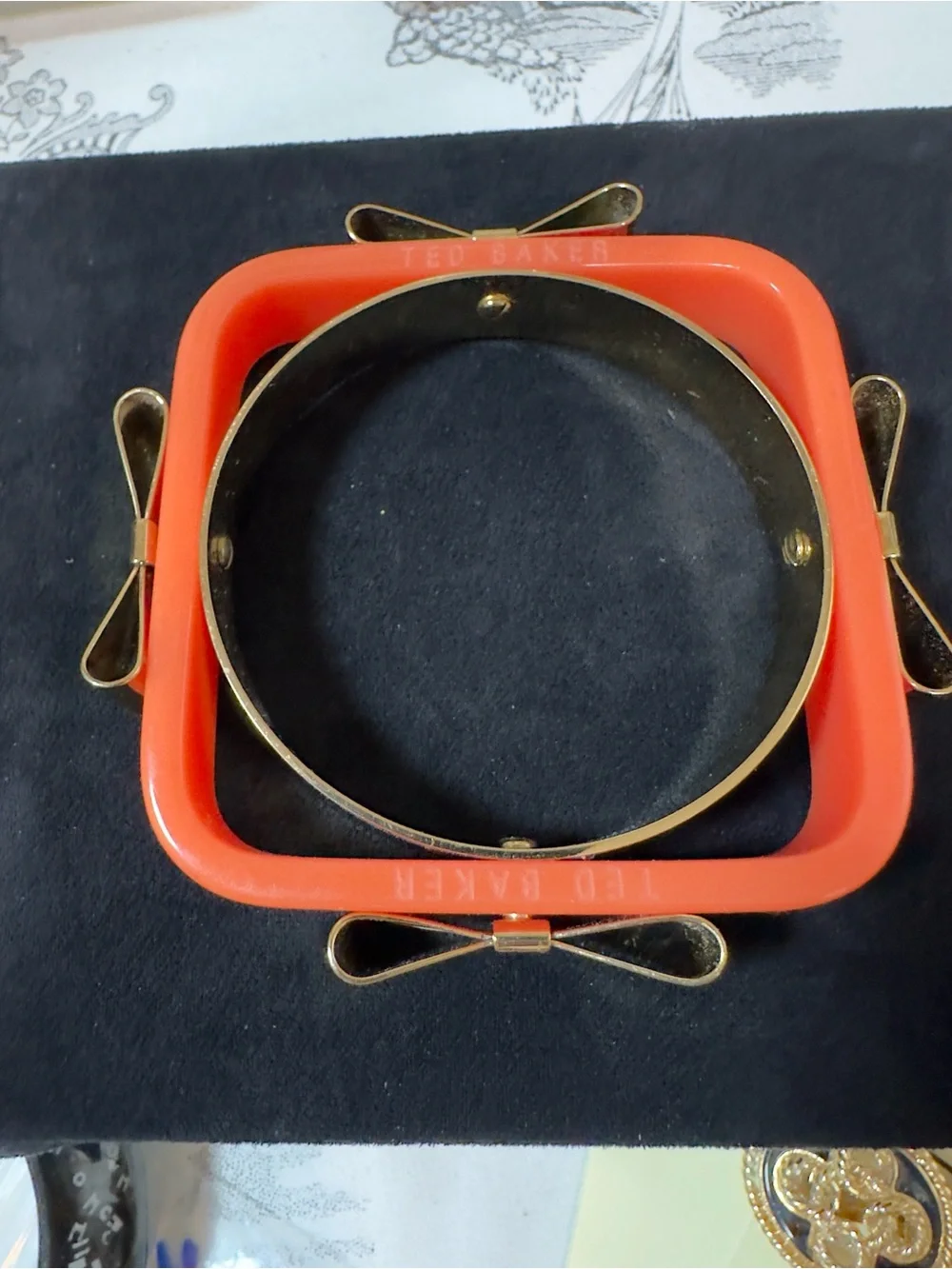 Ted Baker Coral Resin Bangle with Gold Bow Accents